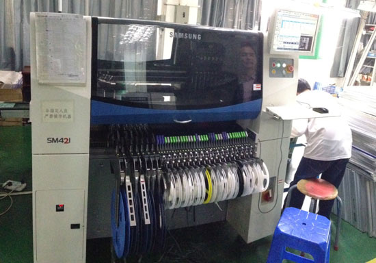 Components are fed into the SMT machine